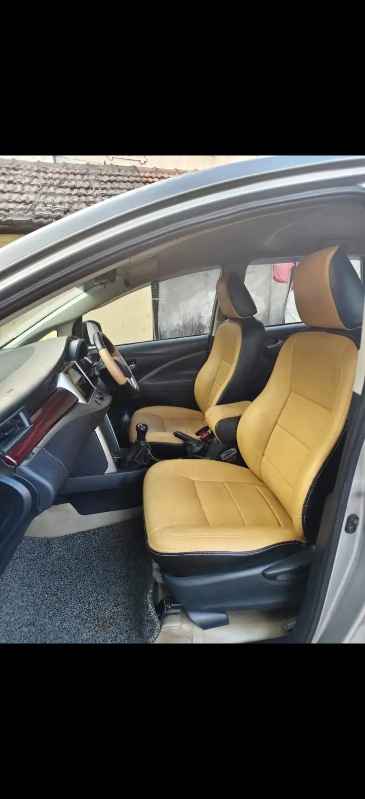 Toyota Innova Crysta front cabin with tan seat covers